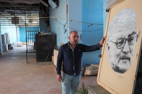 Tarek al-Asaad with the portrait of his late father, Khaled, by Sydney artist Luke Cornish. 