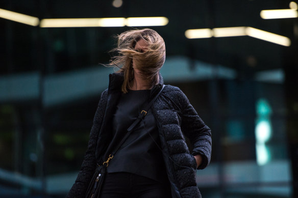 Pedestrians often feel the brunt of strong winds in Docklands.