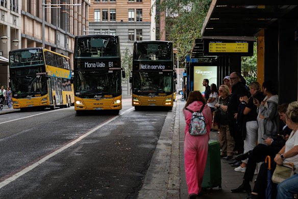 Passengers wait for B-line buses at Wynyard in central Sydney.