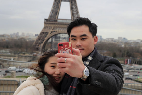 There are fewer Chinese visitors posing in front of the Eiffel Tower in recent weeks.