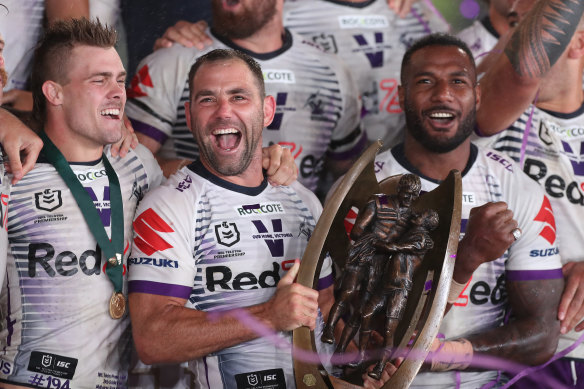 Cameron Smith and the Melbourne Storm with the premiership trophy.