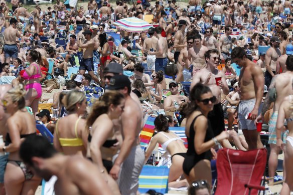 Crowds gather in a beach in South Boston in June 2021.
