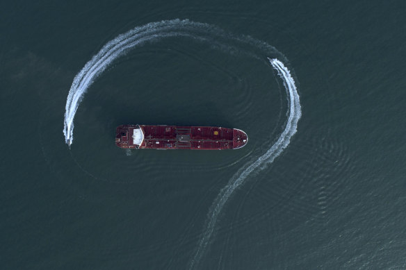 Aerial view of an Iranian Revolutionary Guard speedboat moving around a British oil tanker in the Strait of Hormuz on July 21.