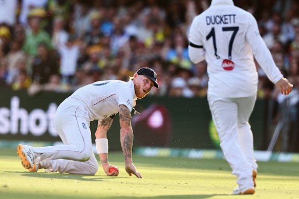 That was close: Ben Stokes takes the catch to dismiss Mitchell Starc, despite a near collision with Ben Duckett.