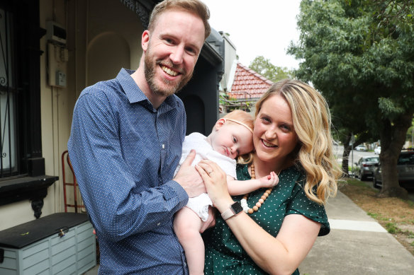 Cara and Adam Steggles with eight-month-old daughter Evie who was born after three rounds of IVF. 