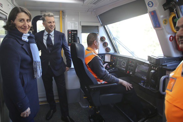 NSW Premier Gladys Berejiklian and Transport Minister Andrew Constance inspect a new CRRC-built Waratah train in 2018.