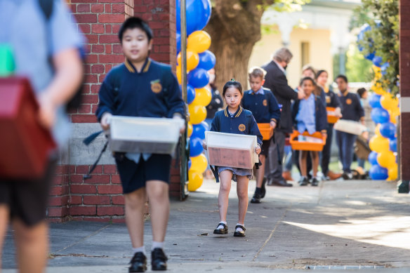 Students at St Brendan’s Primary School in Flemington returning to school in October last year after a COVID-19 shutdown.