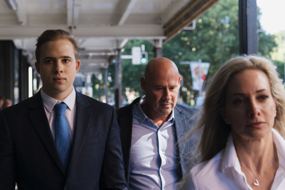 Kyle Daniels  leaves Downing Centre Court with his parents. Daniels is accused of abuse of nine girls at the Mosman Swim Centre in 2018 and 2019. 