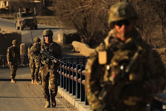 Australian soldiers patrol and search the Puza Bridge for IED’s in Uruzgan, Afghanistan.