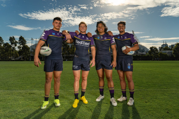 Melbourne Storm captain Harry Grant (second from left) poses with Storm junior players Stanley Huen (from Brisbane), left, Josiah Moreli (Casey Warriors), middle right, and Micah Warena (Casey Warriors), far right.