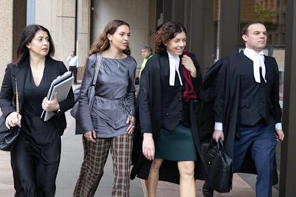 Charlotte MacInnes, second from left, and her legal team outside the Federal Court in Sydney on Wednesday.