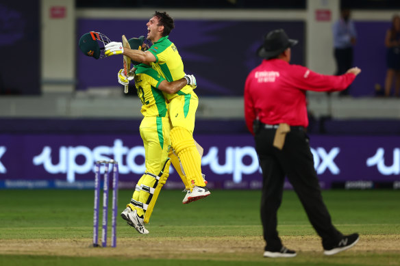 Mitchell Marsh celebrates with Glenn Maxwell after securing the T20 World Cup for Australia.