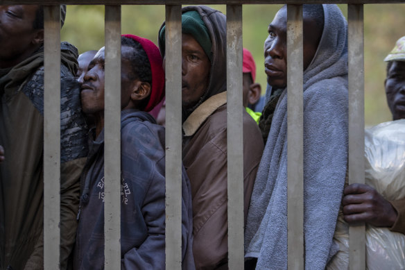 Homeless people queuing for a meal and a shelter in Hillbrow, Johannesburg, South Africa, during a nationwide lockdown.