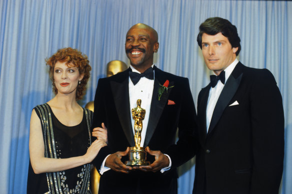 Actress Susan Sarandon (left) and actor Christopher Reeve flank Louis Gossett Jr, winner of the 1982 Academy Award for Best Supporting Actor. 