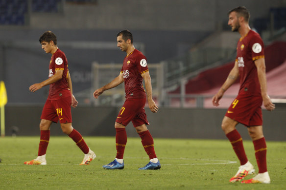 Roma's Gonzalo Villa and his teammates Henrikh Mkhitaryan and Bryan Cristante trudge off after their Serie A loss to lowly Udinese.