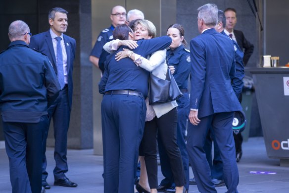 Family members of the police officers gather outside court ahead of Pusey’s sentencing.