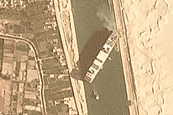 A satellite image shows the vessel wedged in the Suez Canal. 