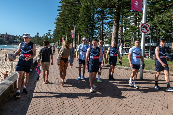 St Helens players stroll along manly promenade shortly after their arrival in Australia earlier this month.