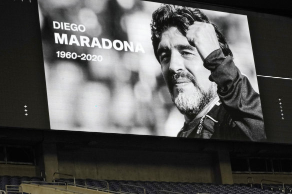 A photo of soccer great Diego Maradona is shown on a large screen during a moment of silence before a match in Seattle, US, on Tuesday.