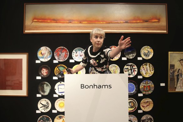 Bonham’s director and auctioneer Merryn Schriever, at Sunday’s auctions of the famous works that graced Lucio’s. Seen at the top is Point to Point. 