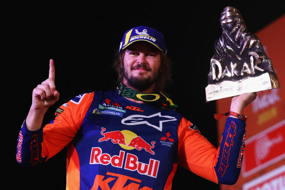 Toby Price celebrates his victory in the Dakar Rally last year.