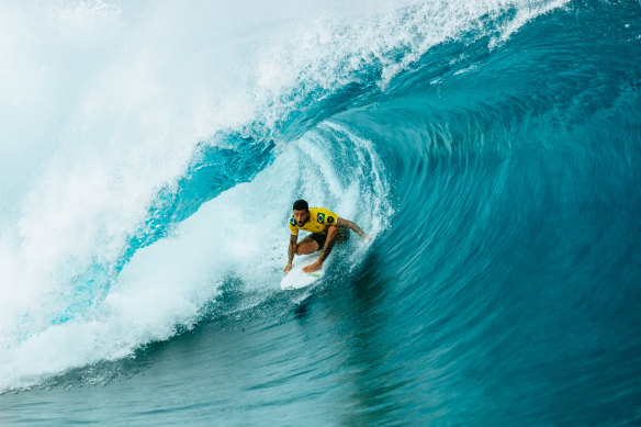 Filipe Toledo tucks into a Teahupo’o barrel during the 2022 Tahiti Pro.