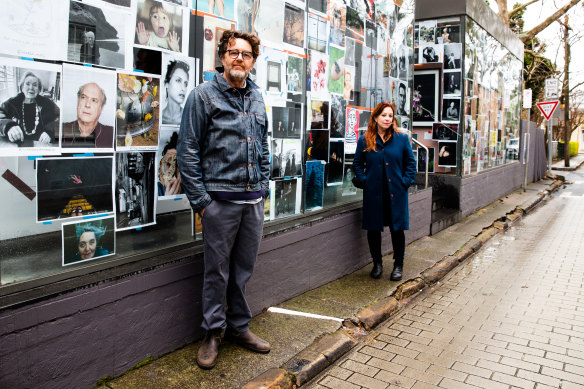 Hugh Stewart and Rachel Knepfer with the Lockdown Picture Show on the street facing windows of the Halls Lane Gallery and Portrait Studio