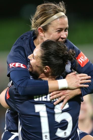 Goalscorer Emily Gielnik (No.15) celebrates with Victory teammate Christine Nairn.