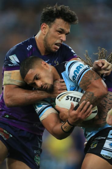 Clash: Will Chambers gets a hold on Ricky Leutele in the 2016 grand final.