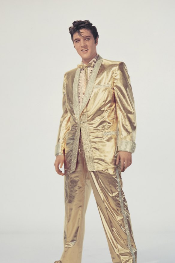 Elvis modelling the gold lame suit commissioned by “Colonel” Tom Parker from famed country and western tailor Nudie Cohn, 1957.