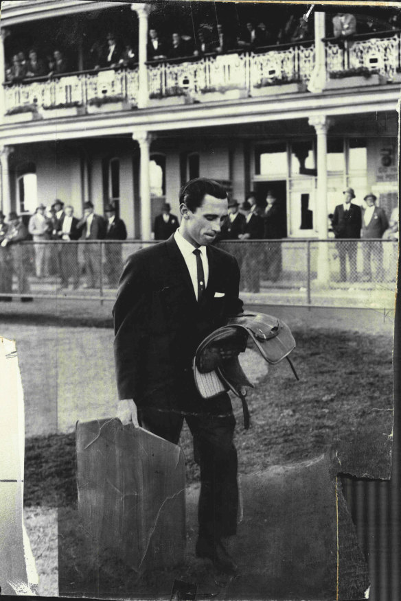 Jockey Mel Schumacher leaves the saddling enclosure at Randwick on September 30, 1961, after being disqualified for life. His ban was subsequently reduced to 10 years.
