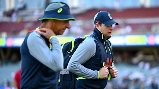 Steve Smith leaving Adelaide Oval with team security boss Frank Dimasi.