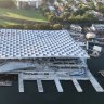 The roof comprises 400 panels arranged to resemble fish scales.
