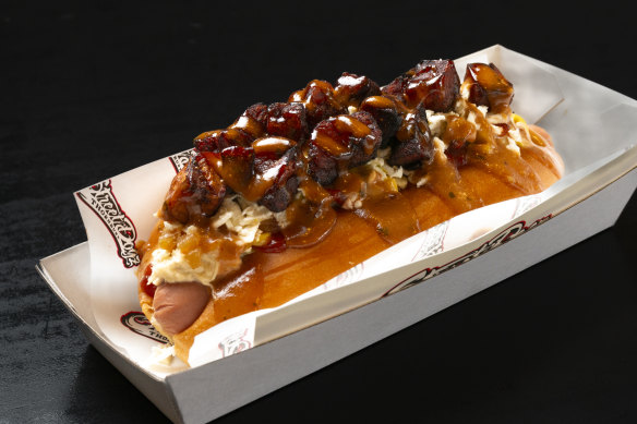The Mochi hot dog topped with shredded chicken, bacon, plantain and house-made barbecue aioli. 