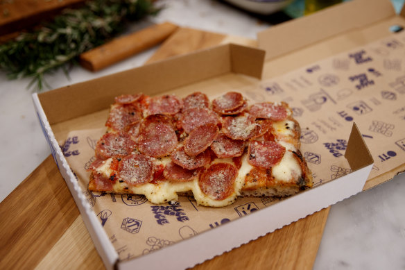 Salami pizza slice.