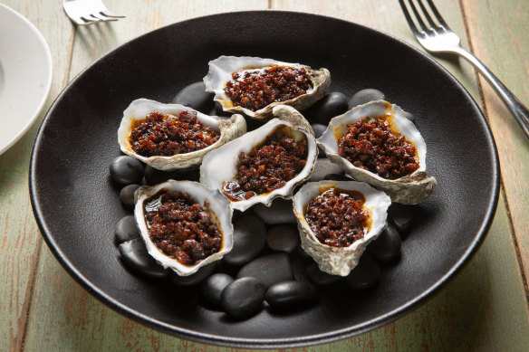 Oysters Kilpatrick, featuring crisp, thinly cut bacon and lashings of Worcestershire.
