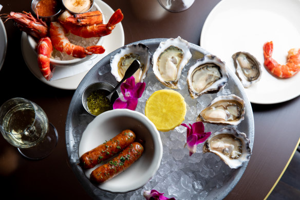 Oysters, sausages and prawn cocktail at Clam Bar. 