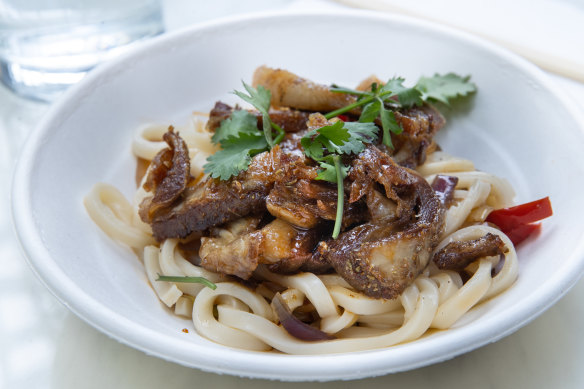 Chewy fat noodles are served with lamb ribs.