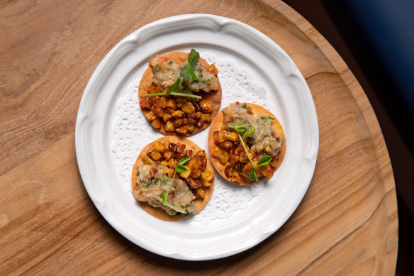 Crab and corn paapdi chaat are on the menu at Enter Via Laundry’s new bar.