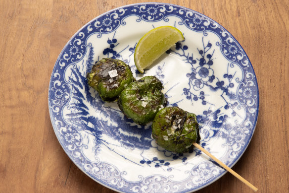 Patra poda, coconut and mustard marinated prawns wrapped in nasturtium leaves.