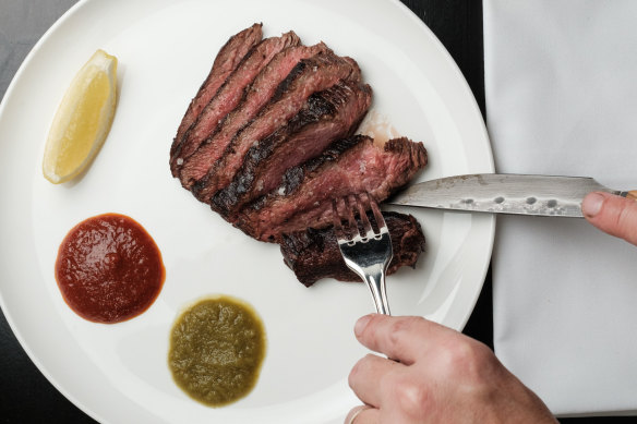 Custom steak knives from Portuguese artisan Telmo Roque glide through the wagyu bolar blade.