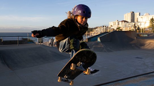Mila McDonald, 9, doing an air out at Bondi Skate Park.