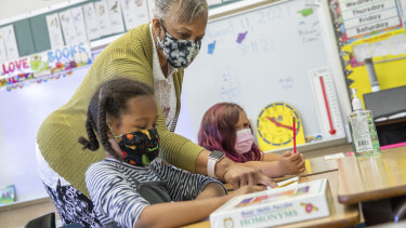 Primary school students wear masks in class at a school in Oakland, California. 