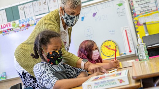 Primary school students wear masks in class at a school in Oakland, California. 