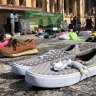 Hundreds of children's shoes laid out in silent Brisbane climate protest