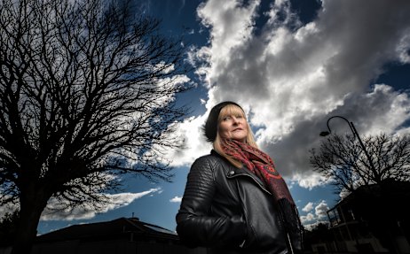 Di McDonald wears a security watch to alert fiends and family to call police if she feels unsafe after prolonged stalking.