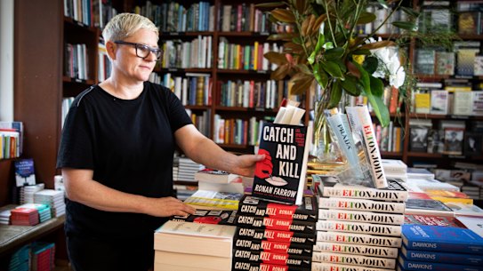 Anna Low, the owner, stacks the shelves at Potts Point Bookshop.