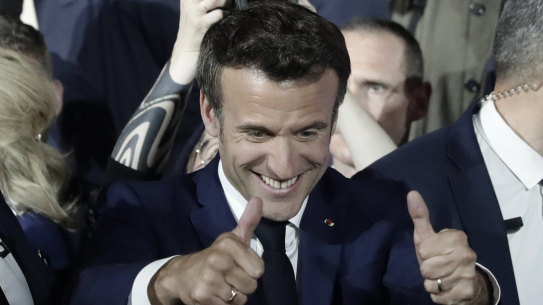 French President Emmanuel Macron thumbs up after reports of his reelection.