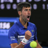 Belligerent: Novak Djokovic wins a key point as he steamrolls Rafael Nadal on centre court.