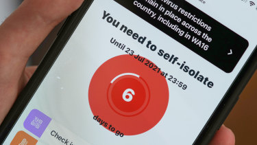 A smartphone using the NHS COVID-19 app alerts the user â€œYou need to self-isolateâ€. 